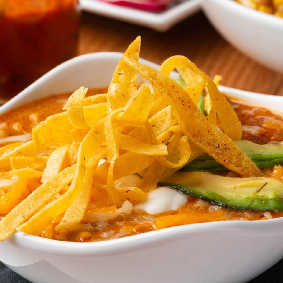 Mezcal Mexican Bar & Kitchen's tortilla soup with avocado, sour cream, and tortilla strips.